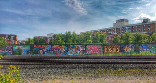 Train on railroad tracks against sky