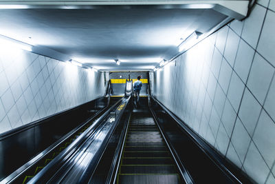 High angle view of man on escalator at subway station