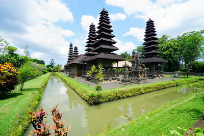 Panoramic view of temple amidst buildings against sky