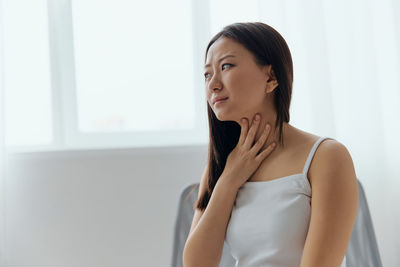 Young woman with neck injury