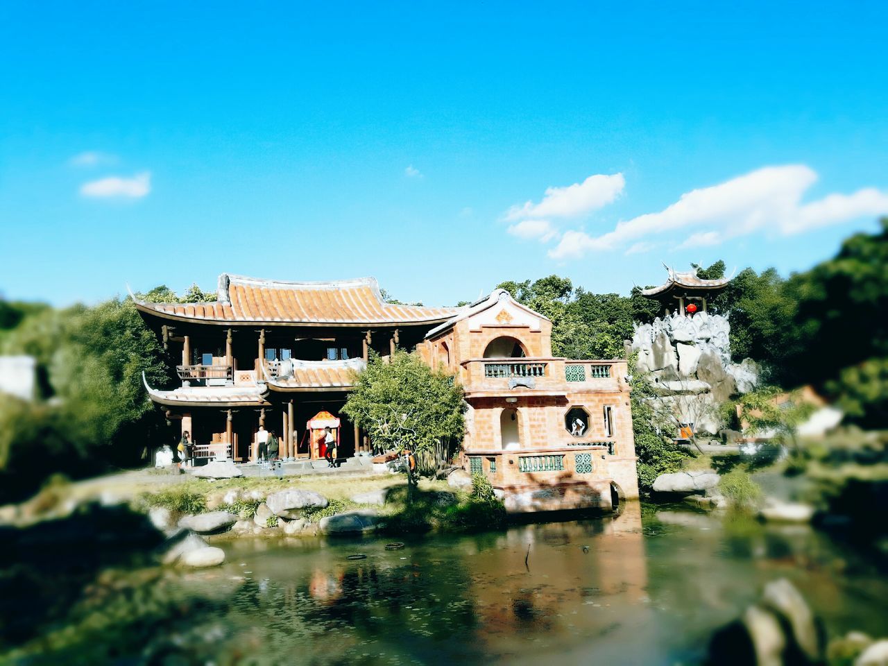 sky, built structure, architecture, cloud - sky, building exterior, reflection, tree, day, water, outdoors, nature, no people, connection, beauty in nature