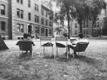 People relaxing on bench