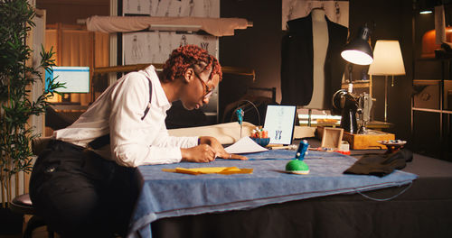 Young woman sitting at home