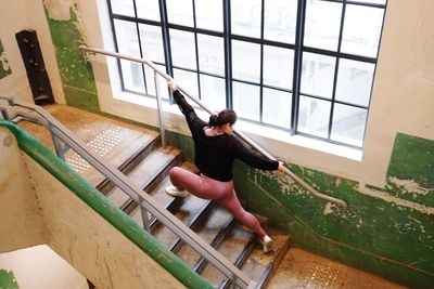 High angle view of woman at window