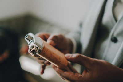 Close-up of man holding hands