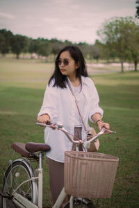 Side view of young woman sitting on wheelchair