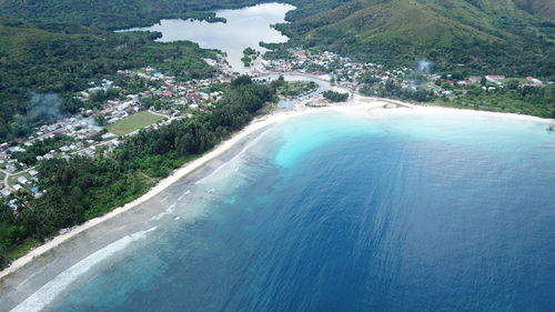 High angle view of swimming pool by sea against sky