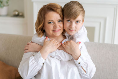 Portrait of smiling young woman with patient at home