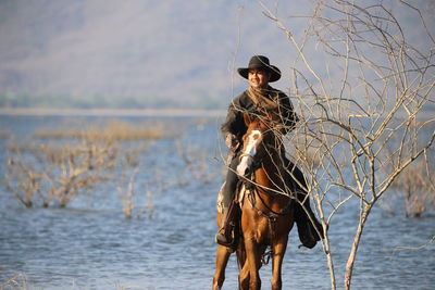 Man riding horse in lake