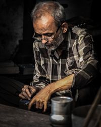 Mature man working in workshop