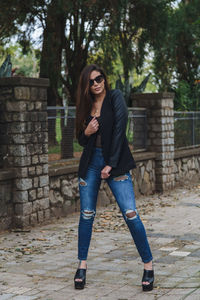 Full length of young woman in park