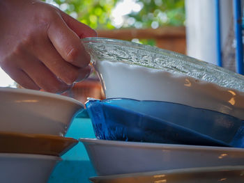 Close-up of hand holding ice cream
