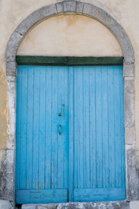 Blue closed door of old building