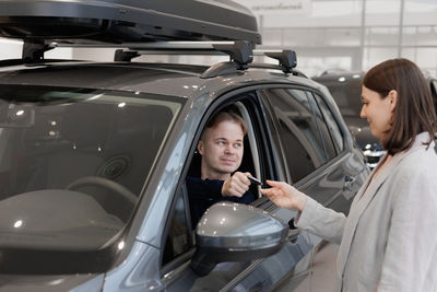 Side view of woman in car