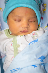 Newborn baby isolated sleeping in white cloth from different angle