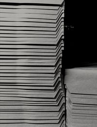 Low angle view of closed stack against wall