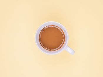 Directly above shot of coffee cup on table