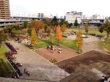 High angle view of crowd in city against sky