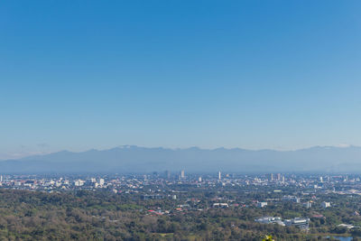 High angle view of townscape against clear blue sky