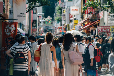 Crowd on street in city