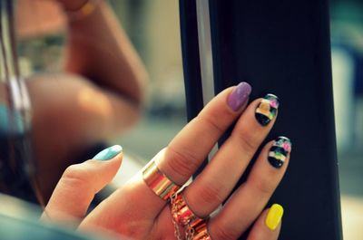 Cropped image of fingers with nail art