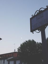 Low angle view of street light against sky