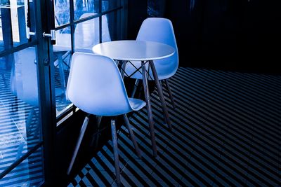 Empty chairs and table in cafe