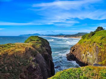 Scenic view of sea against cloudy sky