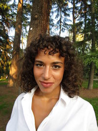 Portrait of young woman in forest