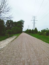 View of electricity pylons on road