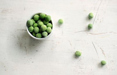 High angle view of green fruits on table