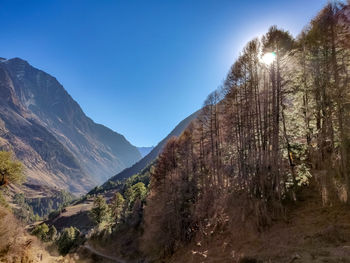 Scenic view of mountains against clear blue sky