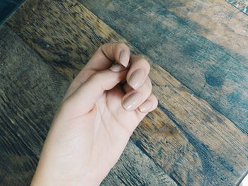 Cropped image of hand with nail polish