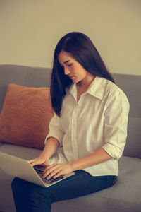 Young woman working on computer.