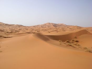 Scenic view of desert against clear sky