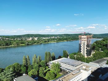 High angle view of buildings against blue sky