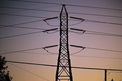 Low angle view of electricity pylon