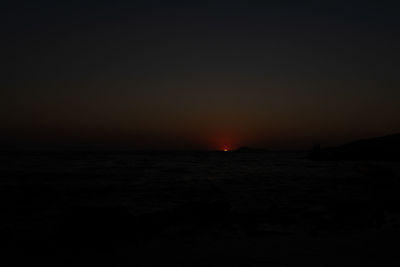 Scenic view of sea against clear sky during sunset