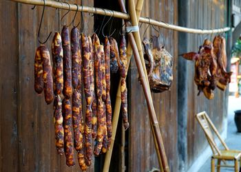 Close-up of meat hanging on barbecue grill