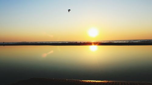 Scenic view of sunset over sea