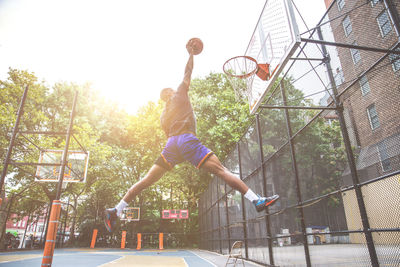 Low angle view of basketball hoop against sky