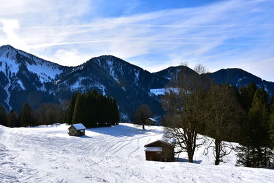 Scenic view of snow covered mountains against sky