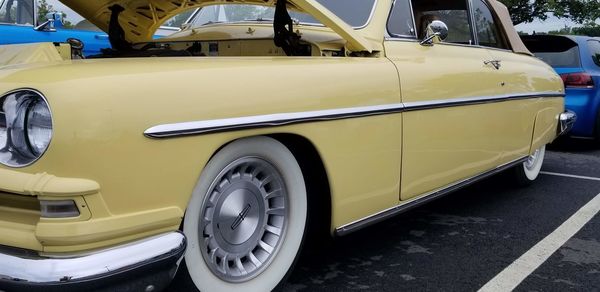 Vintage car parked on road