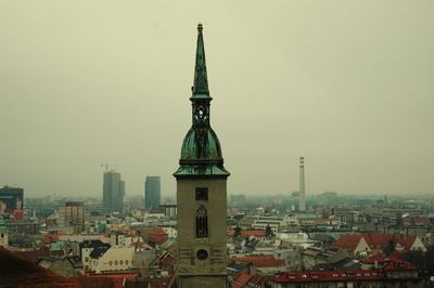View of buildings in city against clear sky