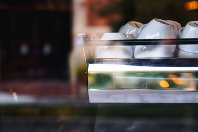 Close-up of wine glass on table at store