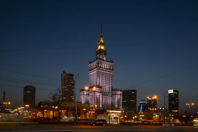 Illuminated buildings in city at night