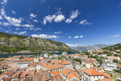 Houses in town against sky