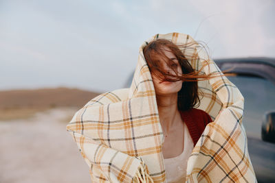 Rear view of woman standing against sky