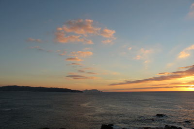 Scenic view of sea at sunset