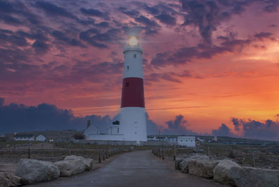 A dramatic sunset at the portland bill lighthouse on the south coast of england in dorset